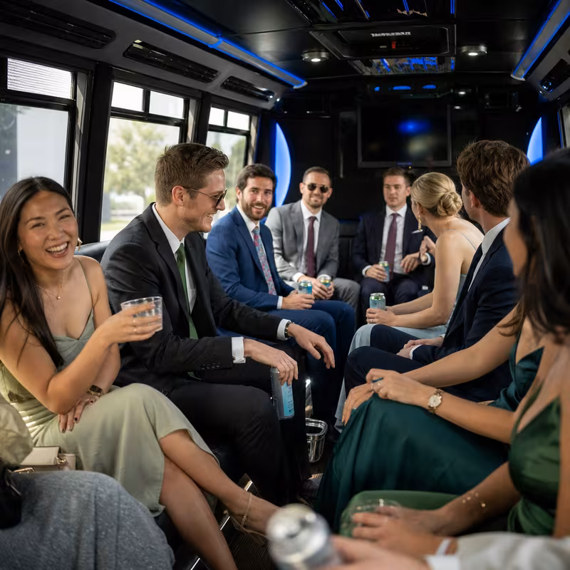 Wedding guests seated inside a Washington party bus