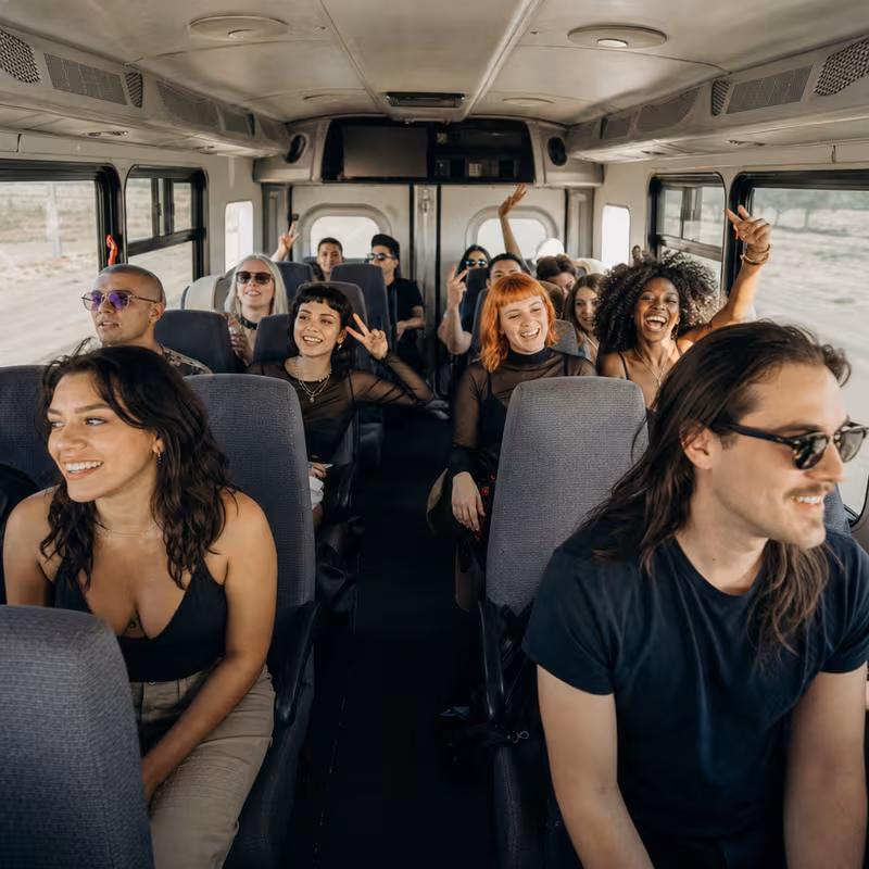 Party bus interior with wraparound leather seating and LED lighting in Washington