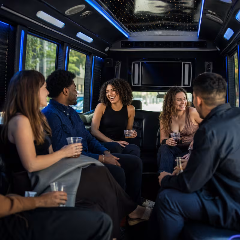 Passengers loading luggage while boarding an Washington group shuttle