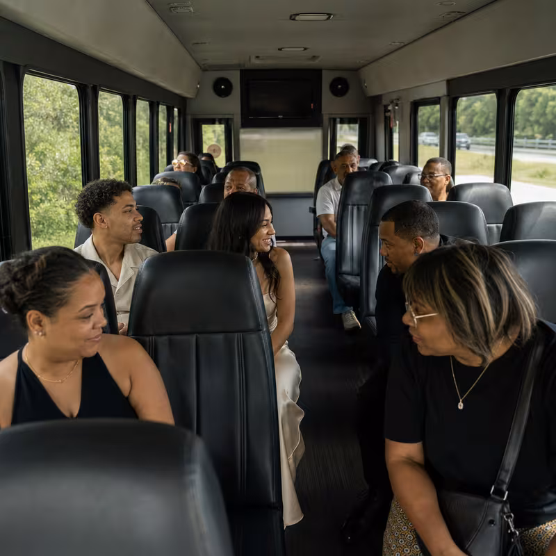 Group boarding a white charter bus for Private Event Transportation transportation in Washington