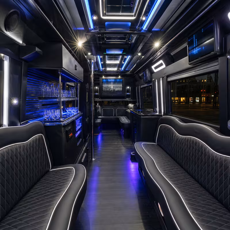 Party bus interior with wraparound leather seating and LED lighting in Washington