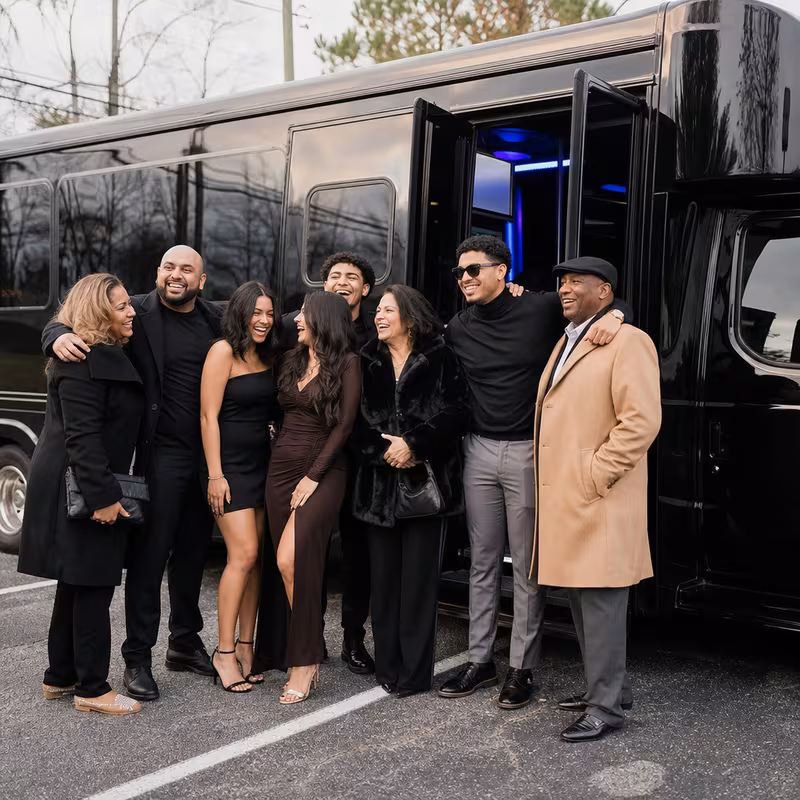 Passengers loading luggage while boarding an Washington group shuttle