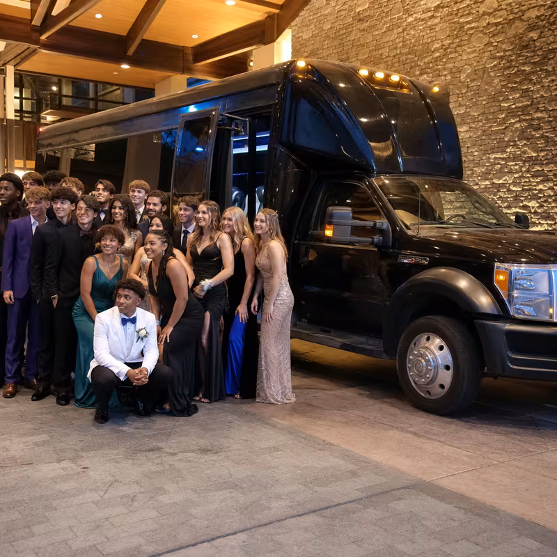 Party bus interior with wraparound leather seating and LED lighting in Washington
