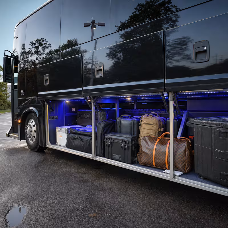 Party bus interior with wraparound leather seating and LED lighting in Washington